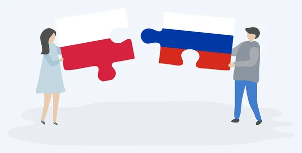 Para Trzyma Dwa Puzzle Kawałki Polskich Rosyjskich Flag Polskie Rosyjskie — Wektor stockowy