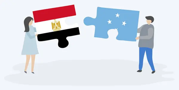 Dvojice Která Drží Dvě Skládanky Egyptskými Milesskými Vlajkami Národní Symboly — Stockový vektor