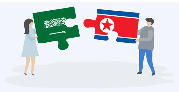 Para Trzymania Dwóch Puzzli Arabii Saudyjskiej Korei Północnej Flagi Symbole — Wektor stockowy