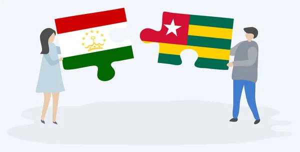 Пара Держащая Две Головоломки Таджикским Тоголезским Флагами Таджикистан Национальные Символы — стоковый вектор