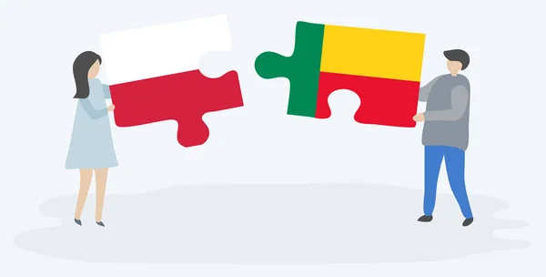 一对夫妇拿着两个拼图片与波兰和贝宁国旗 波兰和贝宁国家符号在一起 — 图库矢量图片