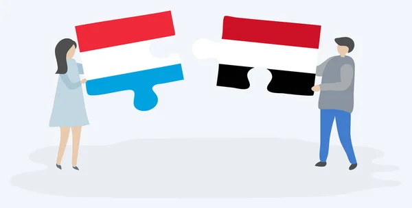 Para Trzyma Dwa Kawałki Puzzle Luksemburskiego Jemeńskiego Flagi Luksemburg Jemen — Wektor stockowy