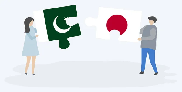 Casal Segurando Duas Peças Quebra Cabeças Com Bandeiras Paquistanesas Japonesas — Vetor de Stock