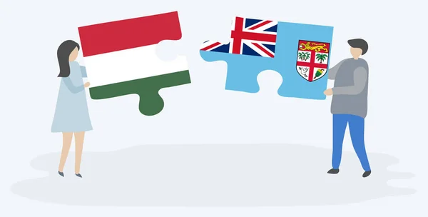 Dvojice Která Drží Dvě Skládanky Maďarským Fijianskými Vlajkami Národní Symboly Stock Vektory