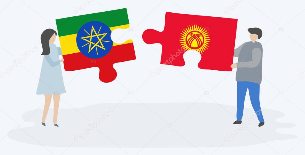 Couple holding two puzzles pieces with Ethiopian and Kirgiz flags. Ethiopia and Kyrgyzstan national symbols together.