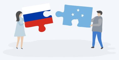 Rus ve Mikronezya bayrakları ile iki bulmaca parçaları tutan çift. Rusya ve Mikronezya ulusal sembolleri birlikte.