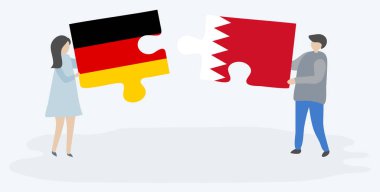 Alman ve Bahreyn bayrakları ile iki bulmaca parçaları tutan çift. Almanya ve Bahreyn ulusal sembolleri birlikte.