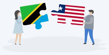 Tanzanya ve Liberya bayrakları ile iki bulmaca parçaları tutan çift. Tanzanya ve Liberya ulusal sembolleri birlikte.