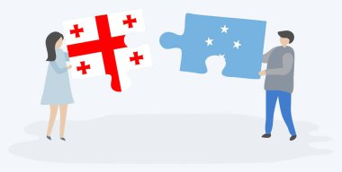 Gürcü ve Mikronezya bayrakları ile iki bulmaca parçaları tutan çift. Gürcistan ve Mikronezya ulusal sembolleri birlikte.