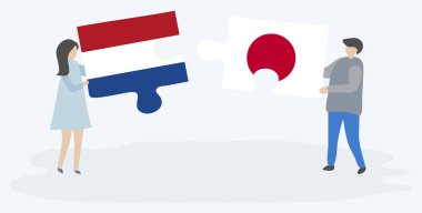 Hollanda ve Japon bayrakları ile iki bulmaca parçaları tutan çift. Hollanda ve Japonya ulusal sembolleri birlikte.