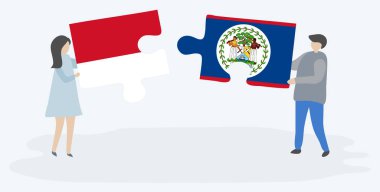 Endonezya ve Belizean bayrakları ile iki bulmaca parçaları tutan çift. Endonezya ve Belize ulusal sembolleri birlikte.