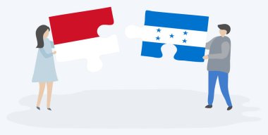 Endonezya ve Honduras bayrakları ile iki bulmaca parçaları tutan çift. Endonezya ve Honduras ulusal sembolleri birlikte.