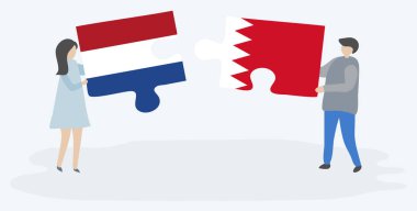 Hollanda ve Bahreyn bayrakları ile iki bulmaca parçaları tutan çift. Hollanda ve Bahreyn ulusal sembolleri birlikte.