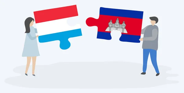 Paar Houden Twee Puzzels Stukken Met Luxemburgse Cambodjaanse Vlaggen Luxemburg — Stockvector