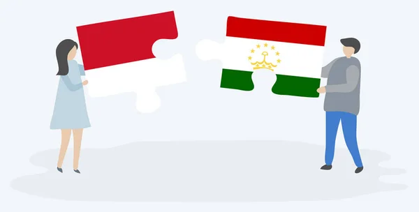 Dvojice Která Drží Dvě Skládanky Vlajkami Indonésie Tádžické Národní Symboly — Stockový vektor