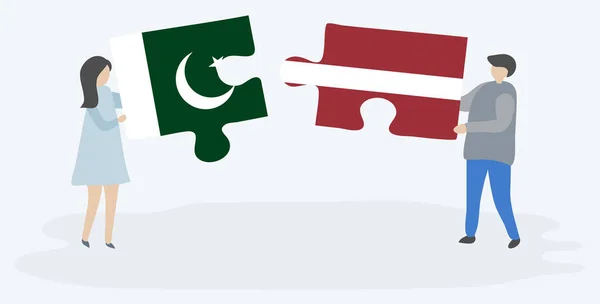 Couple Holding Two Puzzles Pieces Pakistani Latvian Flags Pakistan Latvia — Stock Vector