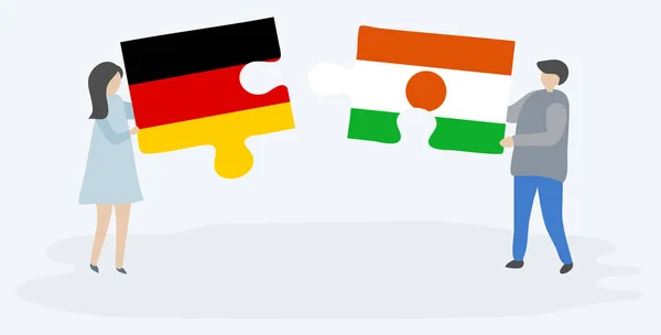 Couple Holding Two Puzzles Pieces German Nigerien Flags Germany Niger — Stock Vector