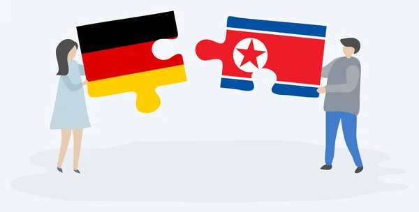 Pareja Sosteniendo Dos Piezas Rompecabezas Con Banderas Alemania Corea Del — Vector de stock