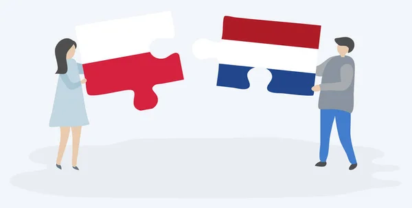 Couple Tenant Deux Pièces Puzzles Avec Des Drapeaux Polonais Néerlandais — Image vectorielle