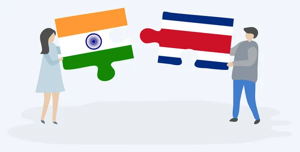 インドとコスタリカの旗を持つ2つのパズルのピースを保持しているカップル インドとコスタリカの国のシンボル — ストックベクタ