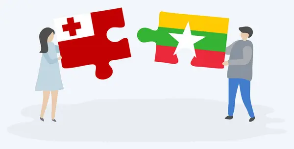 Para Trzyma Dwa Puzzle Kawałki Tongan Birmańskich Flag Symbole Narodowe — Wektor stockowy