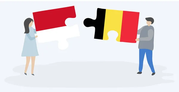 Casal Segurando Dois Quebra Cabeças Peças Com Bandeiras Indonésias Belgas — Vetor de Stock