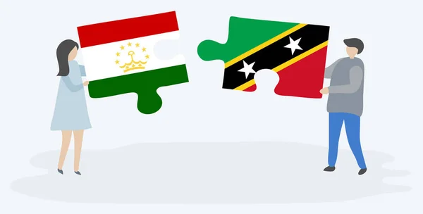 Paar Houden Twee Puzzels Stukken Met Tajikistani Kittitian Vlaggen Tadzjikistan — Stockvector