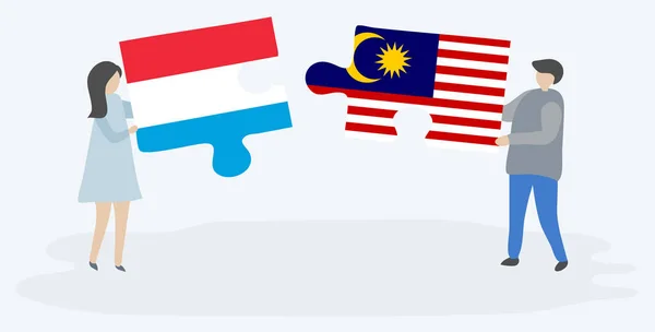 Paar Houden Twee Puzzels Stukken Met Luxemburgse Maleisische Vlaggen Luxemburg — Stockvector