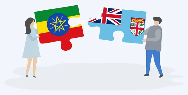 Etiyopya Fiji Bayrakları Ile Iki Bulmaca Parçaları Tutan Çift Etiyopya — Stok Vektör