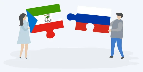 Pareja Sosteniendo Dos Piezas Rompecabezas Con Banderas Guinea Ecuatorial Rusia — Vector de stock