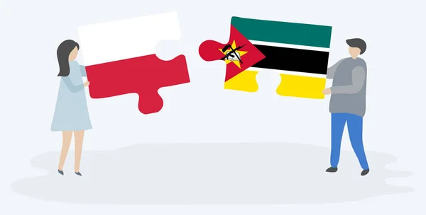 Pár Jich Drží Dvě Skládanky Polskými Mosambickými Vlajkami Národní Symboly — Stockový vektor