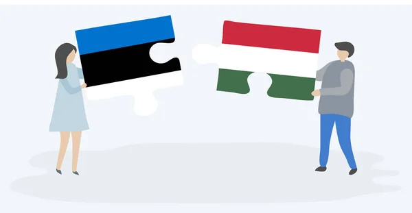 一对夫妇拿着两个拼图片与爱沙尼亚和匈牙利国旗 爱沙尼亚和匈牙利国家符号在一起 — 图库矢量图片