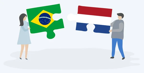 Ζευγάρι Που Κρατά Δύο Κομμάτια Παζλ Βραζιλιάνικα Και Ολλανδικά Σημαίες — Διανυσματικό Αρχείο
