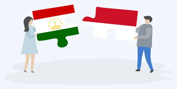 Para Trzyma Dwa Kawałki Puzzli Tadżycki Monako Flagi Tadżykistan Monako — Wektor stockowy