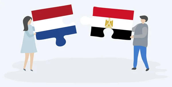 Couple Holding Two Puzzles Pieces Dutch Egyptian Flags Netherlands Egypt — Stock Vector