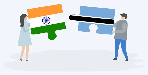 インドとモツワナの旗を持つ2つのパズルピースを保持しているカップル インドとボツワナの国のシンボル — ストックベクタ