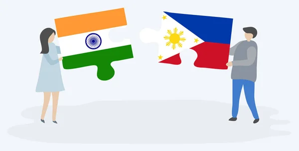 一对夫妇拿着两块拼图 上面挂着印度和菲律宾国旗 印度和菲律宾国家符号在一起 — 图库矢量图片