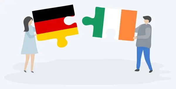 Pareja Sosteniendo Dos Piezas Rompecabezas Con Banderas Alemanas Irlandesas Alemania — Vector de stock