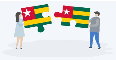 Togolese ve Togo bayrakları ile iki bulmaca parçaları tutan çift. Togo ve Togo ulusal sembolleri birlikte.
