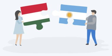 Macar ve Arjantin bayrakları ile iki bulmaca parçaları tutan çift. Macaristan ve Arjantin ulusal sembolleri birlikte.