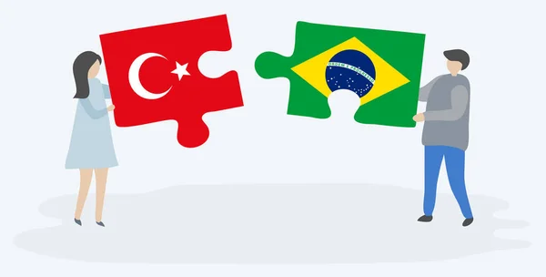 一对夫妇拿着两块拼图 上面挂着土耳其和巴西国旗 土耳其和巴西国家符号在一起 — 图库矢量图片
