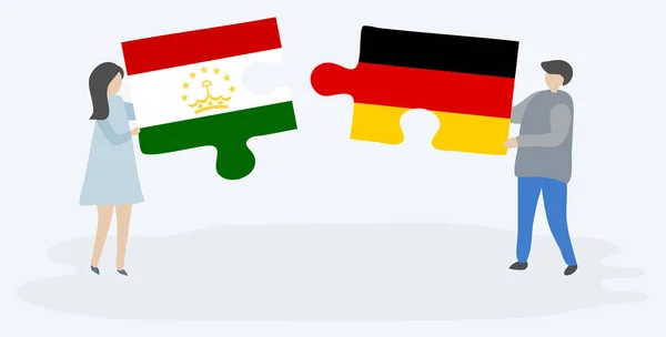 Tacikistani Alman Bayrakları Ile Iki Bulmaca Parçaları Tutan Çift Tacikistan — Stok Vektör