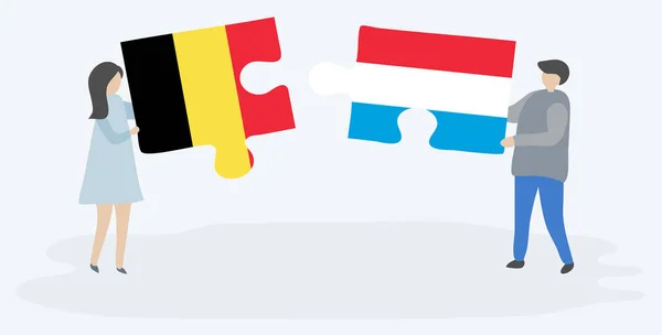 Ζευγάρι Που Κρατά Δύο Κομμάτια Παζλ Βελγικές Και Λουξεμβουργιανή Σημαίες — Διανυσματικό Αρχείο