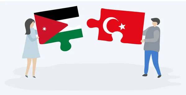 Para Trzymania Dwóch Puzzli Jordańskich Tureckich Flag Jordanii Turcji Symbole — Wektor stockowy