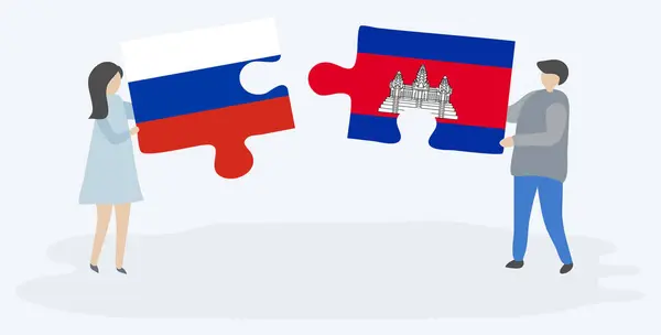 Paar Houden Twee Puzzels Stukken Met Russische Cambodjaanse Vlaggen Rusland — Stockvector