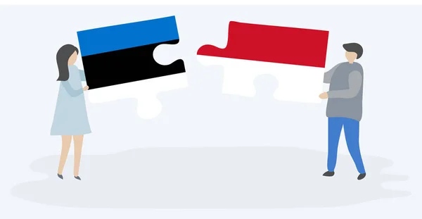 Pareja Sosteniendo Dos Piezas Rompecabezas Con Banderas Estonias Indonesias Estonia — Vector de stock