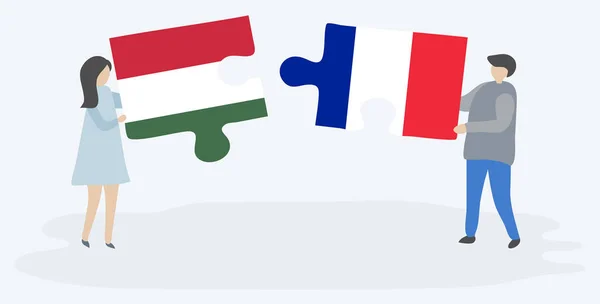Ζευγάρι Που Κρατάει Δύο Κομμάτια Παζλ Ουγγρικά Και Γαλλικά Σημαίες — Διανυσματικό Αρχείο