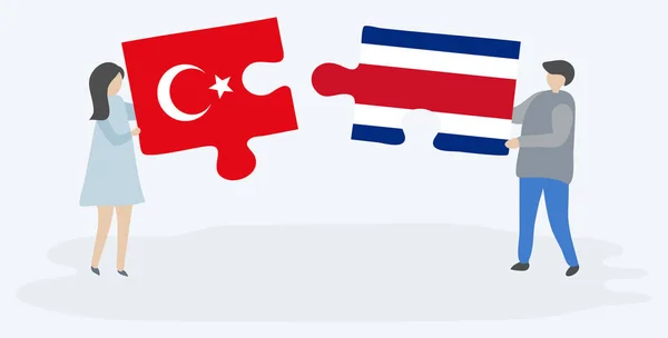 Türk Kosta Rika Bayrakları Ile Iki Bulmaca Parçaları Tutan Çift — Stok Vektör