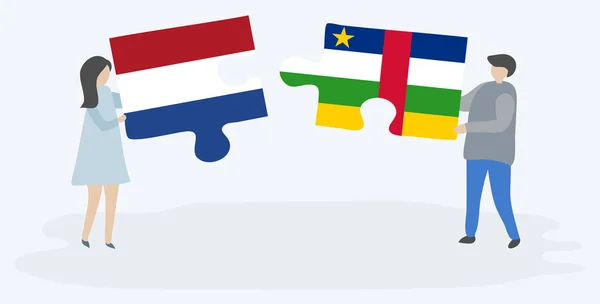 一对夫妇拿着两块拼图 上面挂着荷兰和中非国旗 荷兰和中非共和国国家符号在一起 — 图库矢量图片