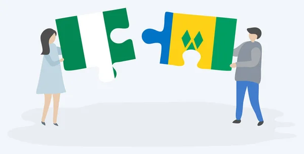 Nijerya Vincent Bayrakları Ile Iki Bulmaca Parçaları Tutan Çift Nijerya — Stok Vektör